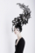 Creative Concept. Portrait of Futuristic Woman in Art Fabulous Headdress